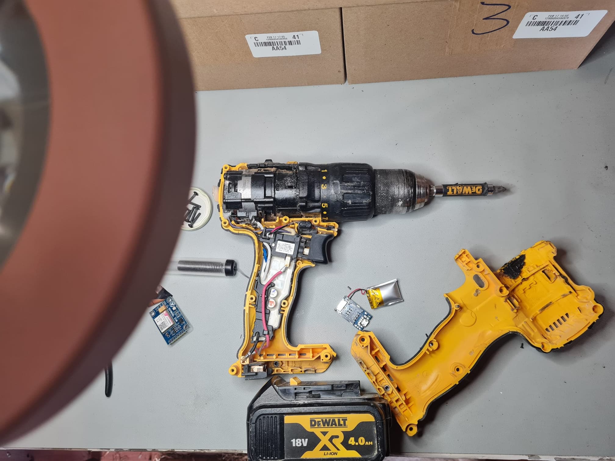 Professional power tools laid out ready for covert GPS tracker fitting